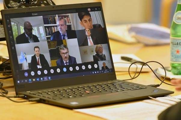 A picture of a laptop showing a video conference meeting